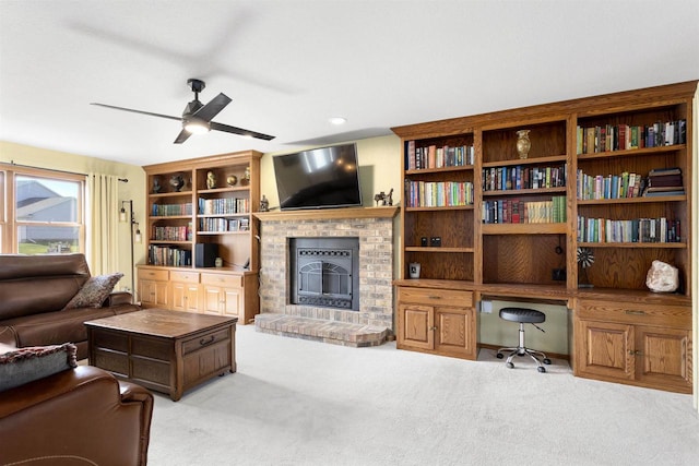 2425 Sandstone Ct, Oshkosh, WI 54904 - carpeted living room with a fireplace, a ceiling fan, and an office area