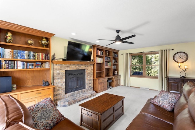 2425 Sandstone Ct, Oshkosh, WI 54904 - living room with ceiling fan, a fireplace, and light carpet