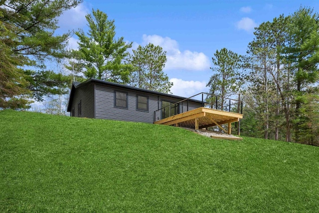 401 George St, Crivitz, WI 54114 - rear view of house with a wooden deck and a lawn