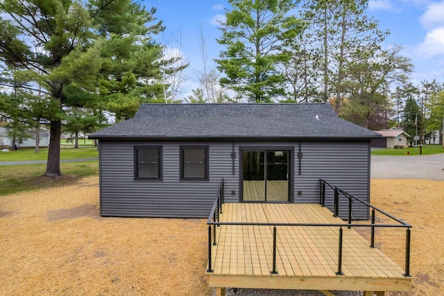 401 George St, Crivitz, WI 54114 - back of property featuring roof with shingles and a wooden deck
