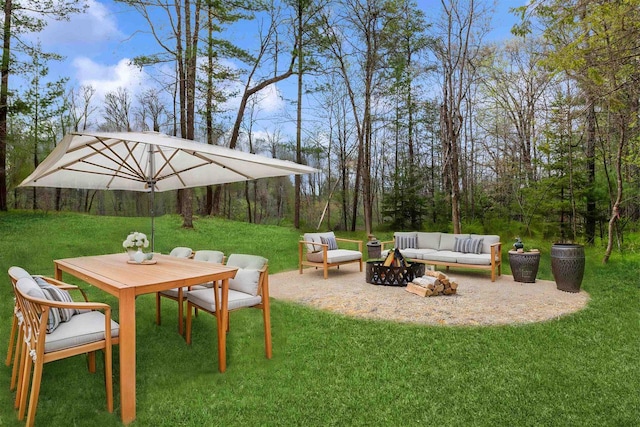 401 George St, Crivitz, WI 54114 - view of grassy yard featuring an outdoor living space with a fire pit, a patio, and outdoor dining area