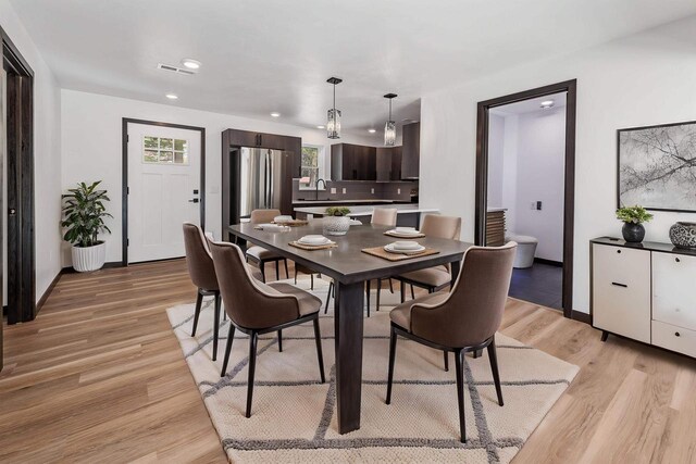 401 George St, Crivitz, WI 54114 - dining space featuring light wood finished floors, baseboards, and recessed lighting