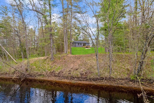 401 George St, Crivitz, WI 54114 - back of property with a yard and a water view