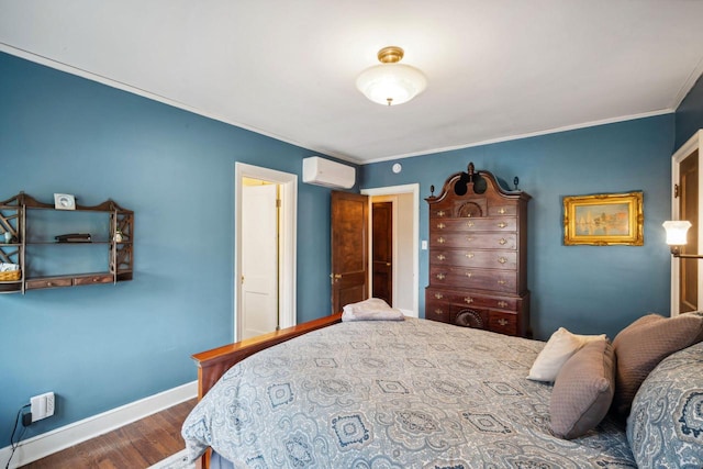 2017 N Terrace Ave, Milwaukee, WI 53202 - bedroom with a wall unit AC, ornamental molding, wood finished floors, and baseboards