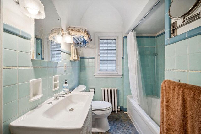2017 N Terrace Ave, Milwaukee, WI 53202 - bathroom with radiator, tile walls, toilet, shower / bath combo, and vanity