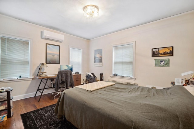 2017 N Terrace Ave, Milwaukee, WI 53202 - bedroom featuring an AC wall unit, wood-type flooring, baseboards, multiple windows, and crown molding