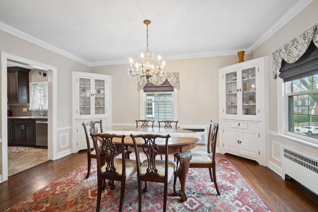 2017 N Terrace Ave, Milwaukee, WI 53202 - dining room with radiator, dark wood-style floors, a chandelier, and crown molding