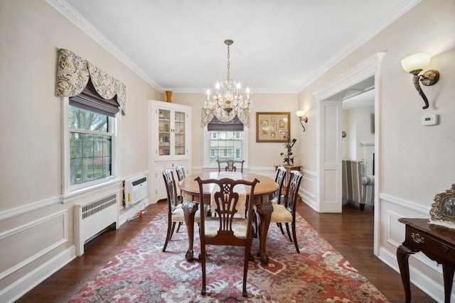 2017 N Terrace Ave, Milwaukee, WI 53202 - dining area with radiator heating unit, a chandelier, plenty of natural light, a decorative wall, and ornamental molding