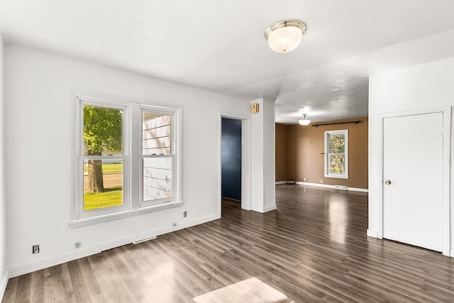 412 W Chestnut St, Pardeeville, WI 53954 - empty room with wood finished floors and baseboards