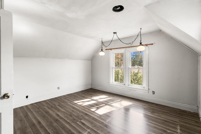 412 W Chestnut St, Pardeeville, WI 53954 - additional living space with vaulted ceiling, baseboards, and wood finished floors