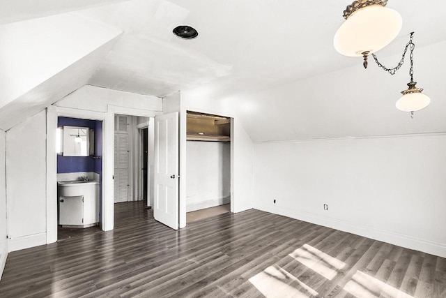 412 W Chestnut St, Pardeeville, WI 53954 - bonus room featuring lofted ceiling, wood finished floors, and baseboards