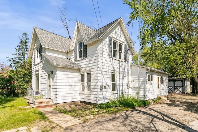 412 W Chestnut St, Pardeeville, WI 53954 - view of home's exterior with roof with shingles