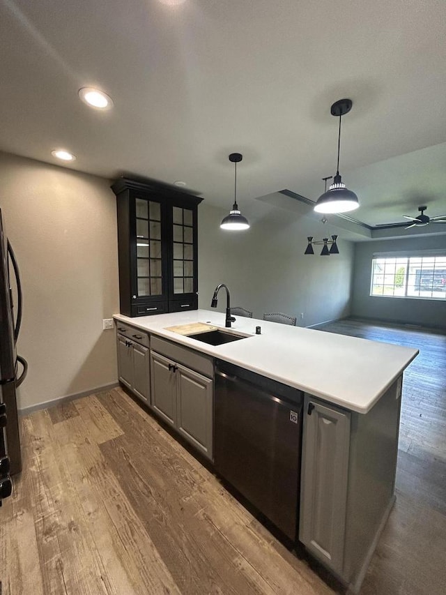 1341 S Wilson Ave Unit 10-4, Hartford, WI 53027 - kitchen featuring dishwashing machine, gray cabinets, wood finished floors, a sink, and a ceiling fan