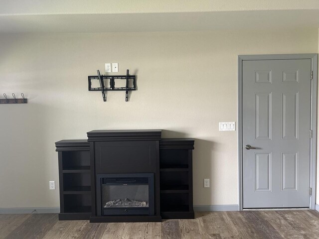 1341 S Wilson Ave Unit 10-4, Hartford, WI 53027 - detailed view of wood finished floors and baseboards