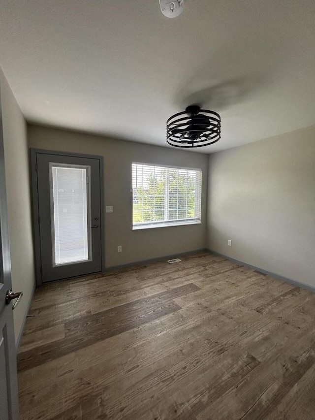 1341 S Wilson Ave Unit 10-4, Hartford, WI 53027 - unfurnished dining area featuring wood finished floors and baseboards