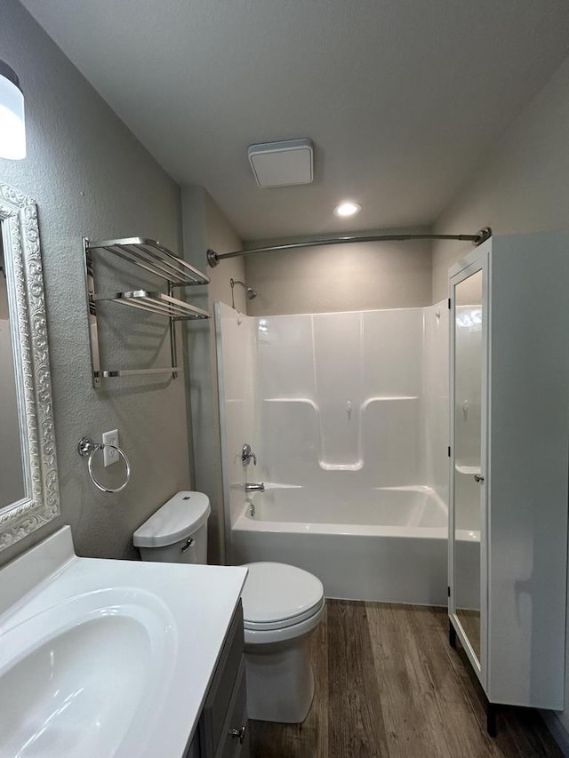 1341 S Wilson Ave Unit 10-4, Hartford, WI 53027 - full bathroom with wood finished floors, toilet, vanity, tub / shower combination, and a textured wall