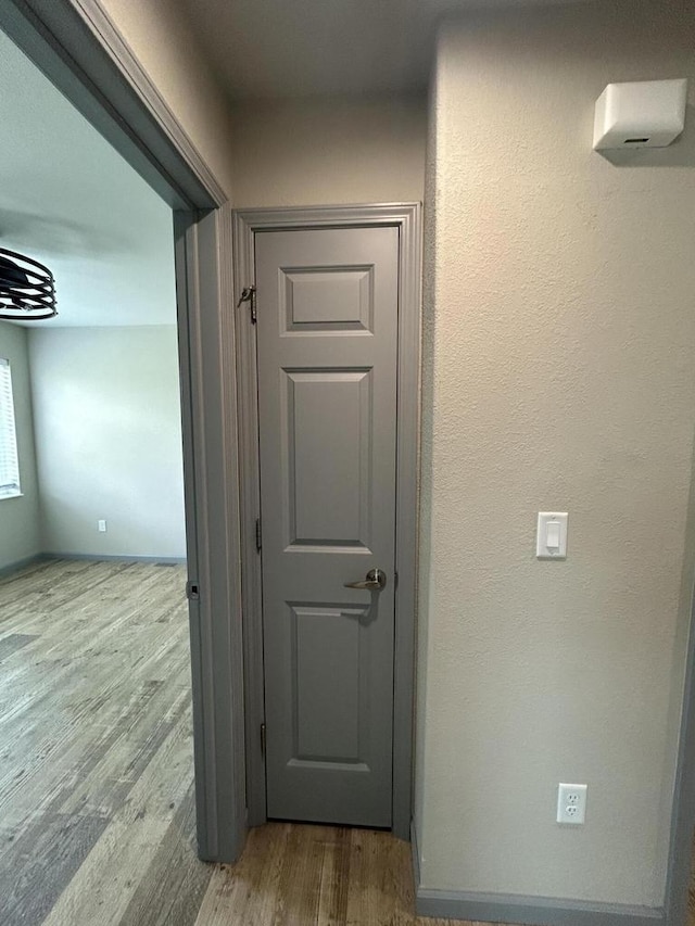 1341 S Wilson Ave Unit 10-4, Hartford, WI 53027 - hallway featuring wood finished floors
