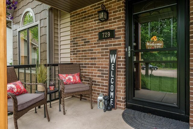 729 Parkway Dr, Mount Horeb, WI 53572 - property entrance featuring brick siding and covered porch