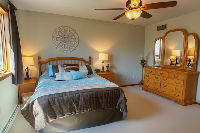 729 Parkway Dr, Mount Horeb, WI 53572 - carpeted bedroom with baseboards, ceiling fan, and multiple windows