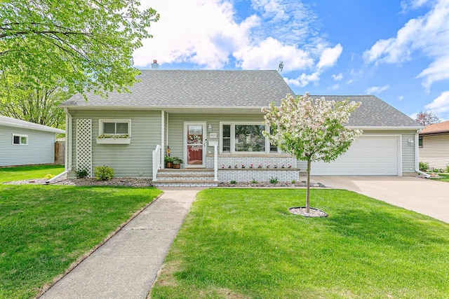 view of front of house featuring driveway, an attached garage, a front lawn, and a shingled roof