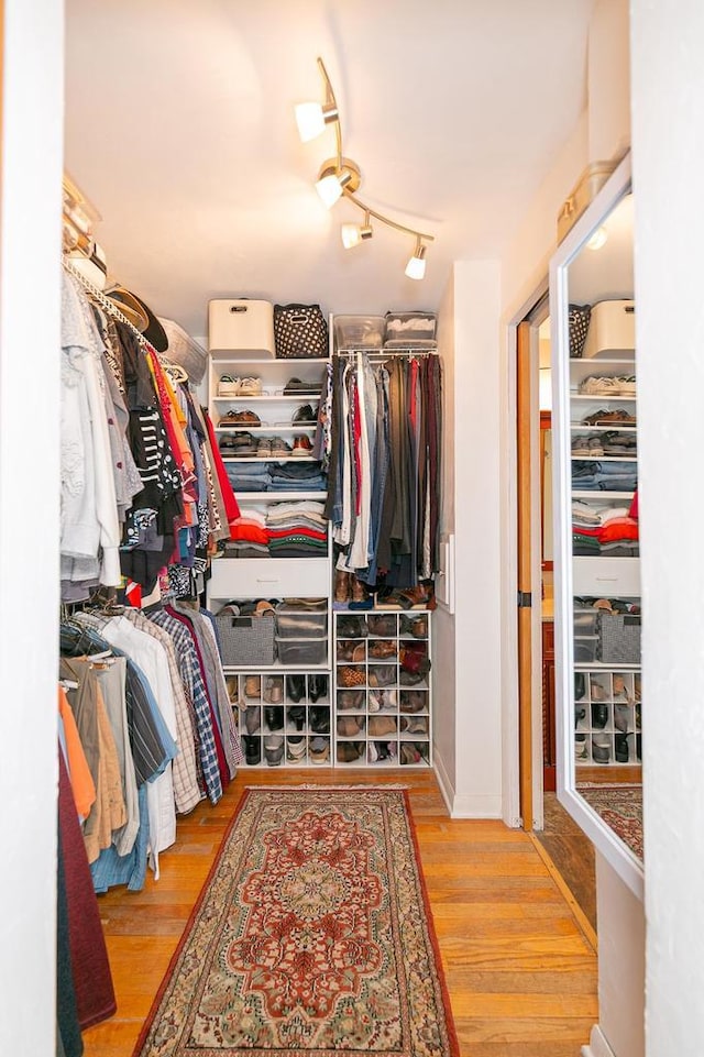 spacious closet with wood finished floors