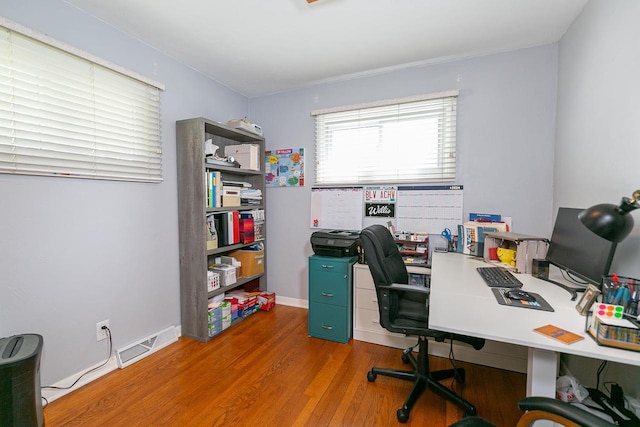 office space with wood finished floors