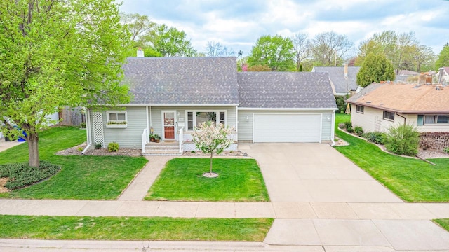 view of front of home with a garage, driveway, a front lawn, and a shingled roof