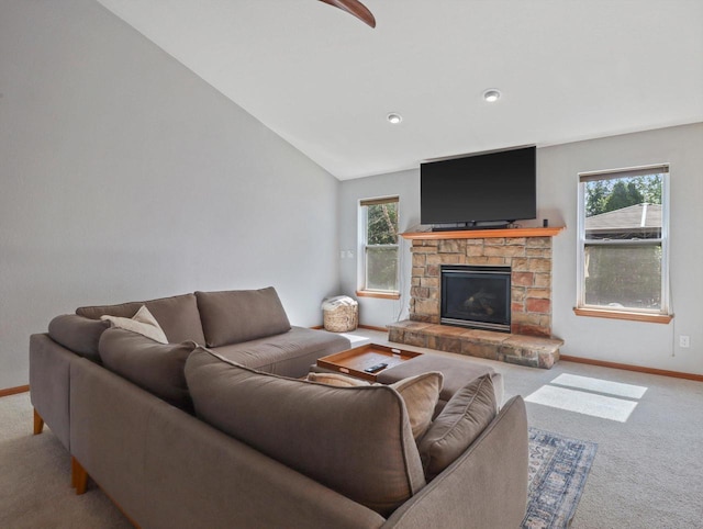 1537 Whitewater Dr, West Bend, WI 53095 - living area featuring carpet floors, healthy amount of natural light, a fireplace, baseboards, and vaulted ceiling