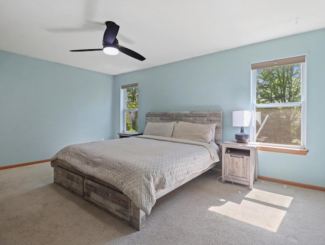 1537 Whitewater Dr, West Bend, WI 53095 - carpeted bedroom with baseboards and ceiling fan