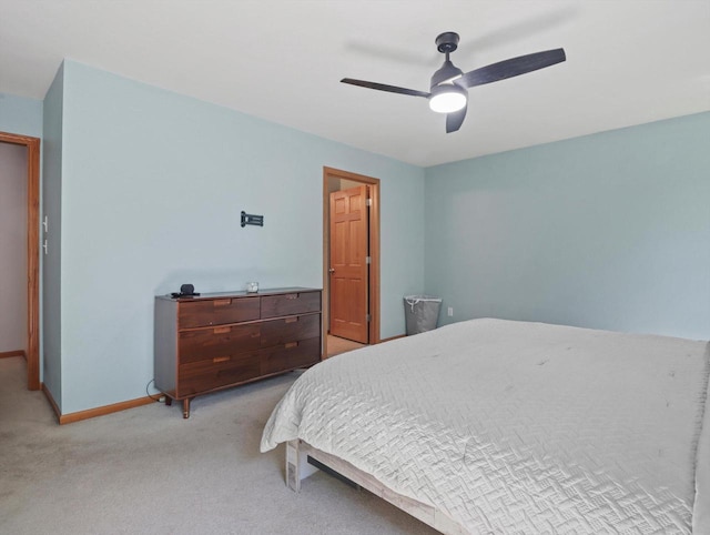 1537 Whitewater Dr, West Bend, WI 53095 - bedroom featuring light colored carpet, baseboards, and ceiling fan