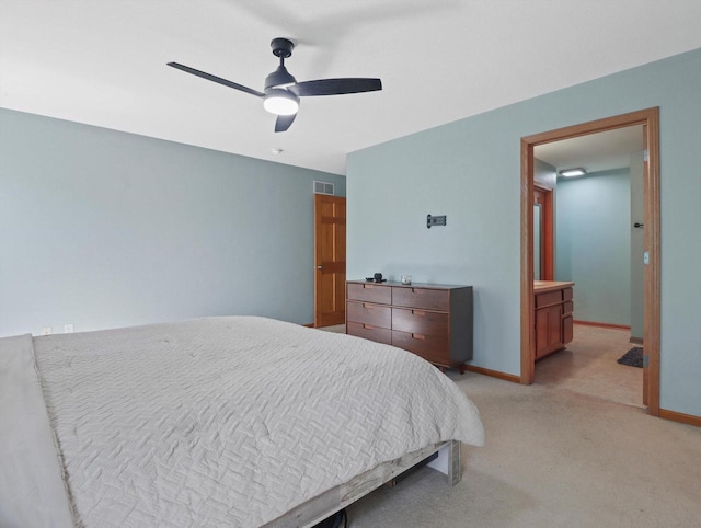 1537 Whitewater Dr, West Bend, WI 53095 - bedroom with light carpet, baseboards, and ceiling fan