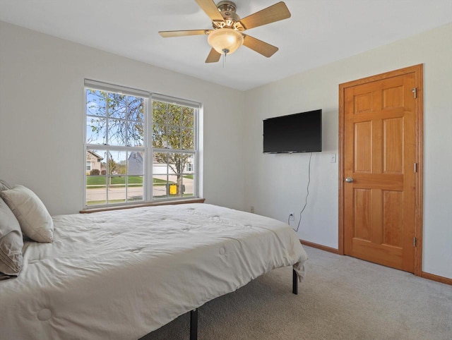 1537 Whitewater Dr, West Bend, WI 53095 - carpeted bedroom with baseboards and ceiling fan