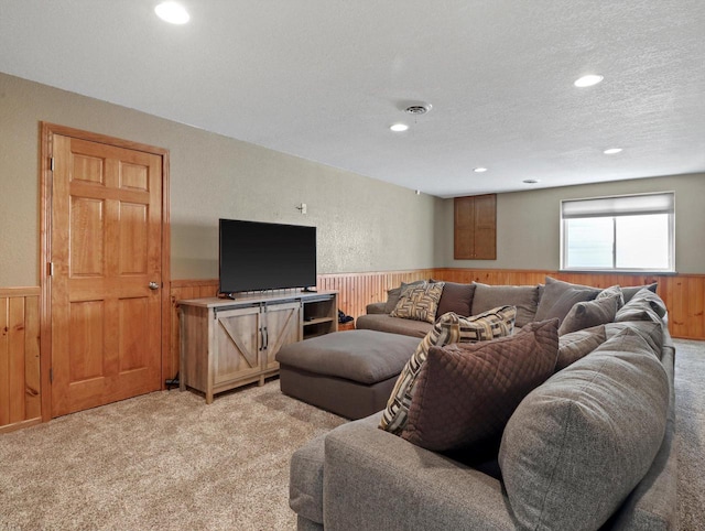 1537 Whitewater Dr, West Bend, WI 53095 - living room featuring light colored carpet, wainscoting, wooden walls, and recessed lighting