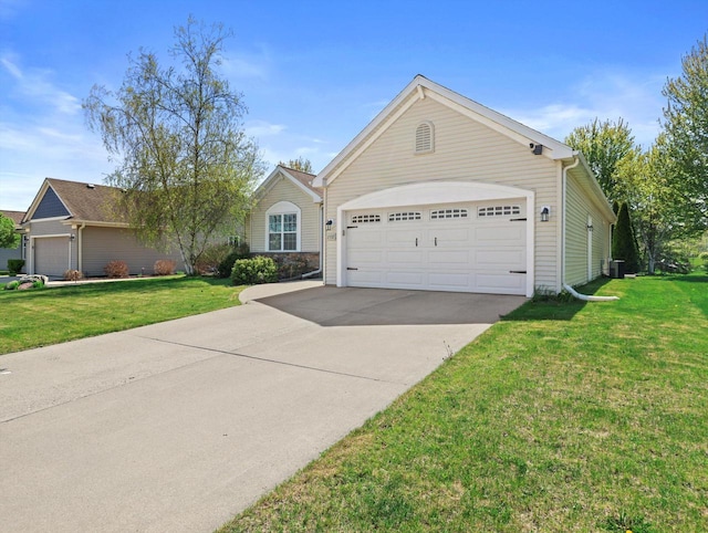 1537 Whitewater Dr, West Bend, WI 53095 - single story home featuring a front yard, concrete driveway, and a garage