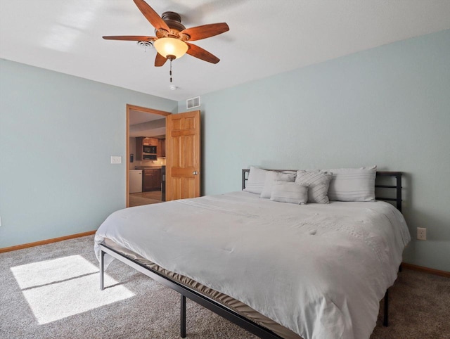 1537 Whitewater Dr, West Bend, WI 53095 - carpeted bedroom featuring baseboards and ceiling fan