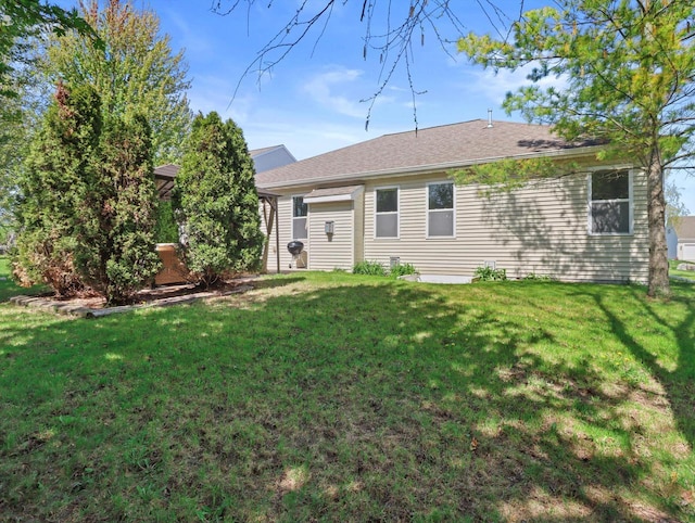 1537 Whitewater Dr, West Bend, WI 53095 - rear view of property with a lawn