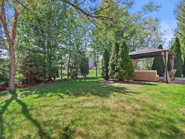 1537 Whitewater Dr, West Bend, WI 53095 - view of grassy yard featuring a gazebo and outdoor lounge area