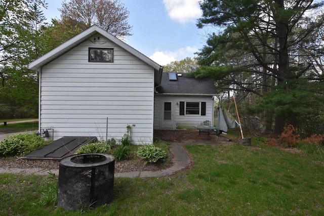 1118 E Pearl St, Neshkoro, WI 54960 - back of property with a shingled roof and a yard