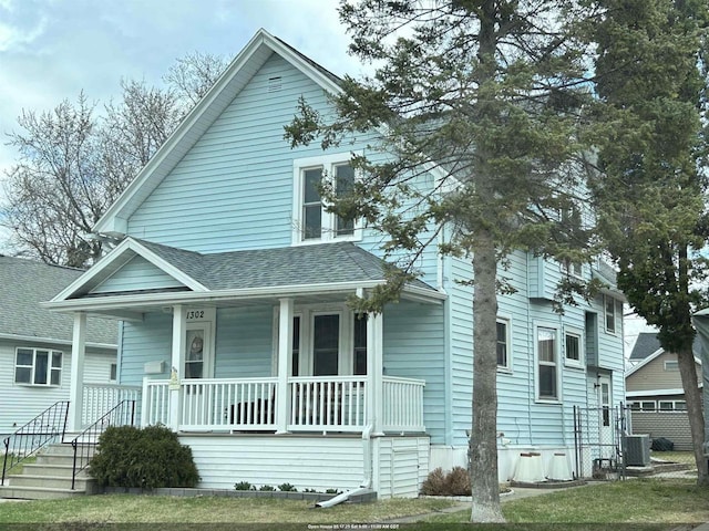 view of front facade featuring a porch and a shingled roof