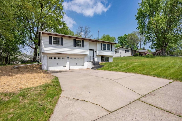 1725 Algonquin Dr, Baraboo, WI 53913 - raised ranch with an attached garage, concrete driveway, and a front lawn