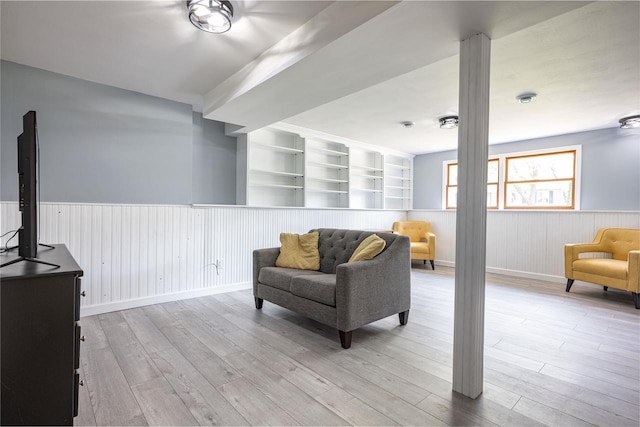 1725 Algonquin Dr, Baraboo, WI 53913 - living area featuring wainscoting and light wood-style flooring