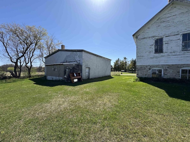 2897 County Road A, Oconto, WI 54153 - view of property exterior with a yard and a chimney