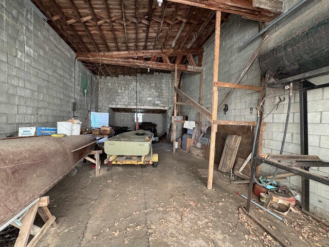 2897 County Road A, Oconto, WI 54153 - misc room featuring concrete block wall and lofted ceiling