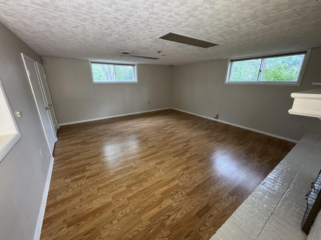 empty room with wood finished floors and baseboards