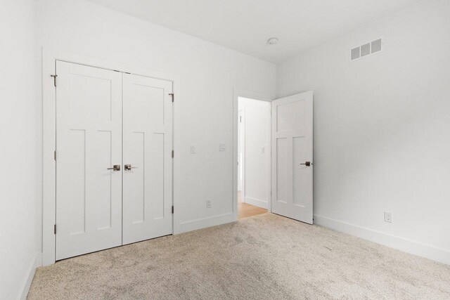 80 Oak Ridge Trl, Deerfield, WI 53531 - unfurnished bedroom with carpet floors, baseboards, and a closet