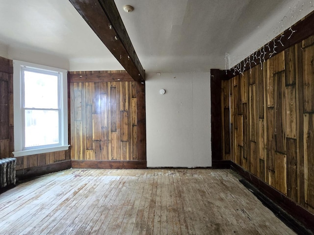 902 S 25th St, Milwaukee, WI 53204 - spare room with hardwood / wood-style flooring, wooden walls, beam ceiling, baseboards, and a smoke detector
