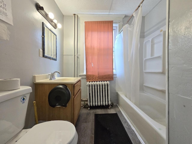 902 S 25th St, Milwaukee, WI 53204 - full bath with radiator, toilet, wood finished floors, shower / bathtub combination with curtain, and vanity