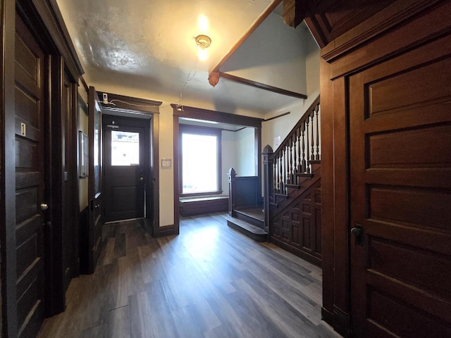 902 S 25th St, Milwaukee, WI 53204 - foyer entrance featuring stairs, dark wood finished floors, and baseboards