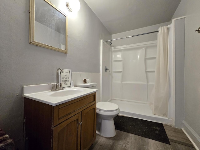 902 S 25th St, Milwaukee, WI 53204 - bathroom featuring wood finished floors, vanity, and a shower stall