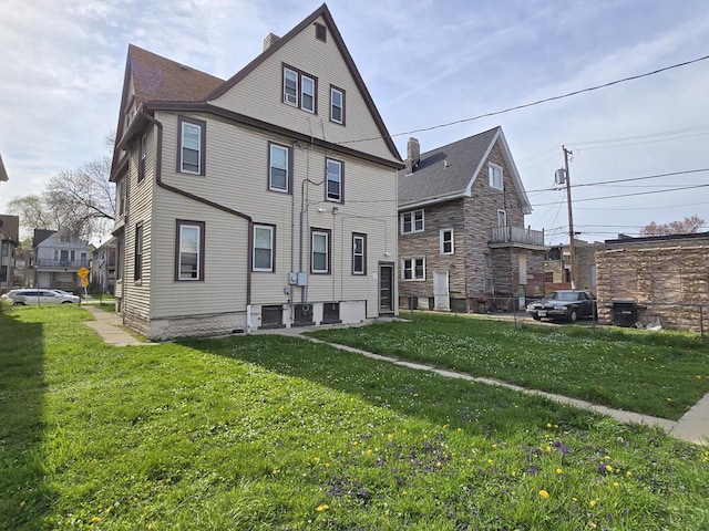 902 S 25th St, Milwaukee, WI 53204 - rear view of property with a chimney